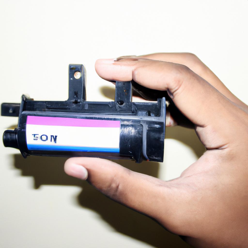 Person holding ink toner cartridge