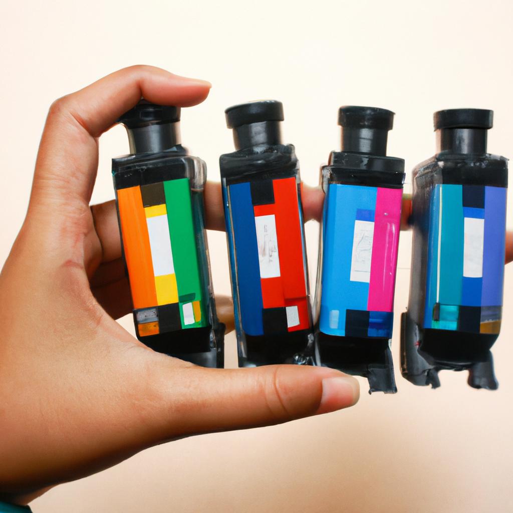Person holding different toner cartridges